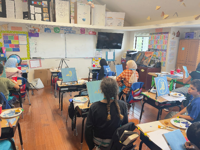 Classroom with students sitting at desks, facing forward.